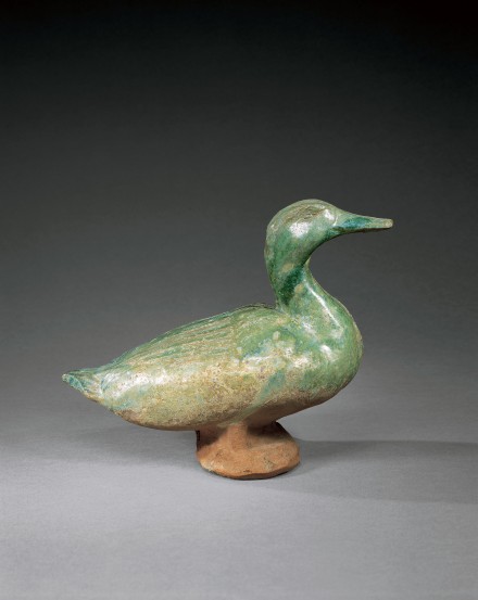 A LARGE IRIDESCENT GREEN-GLAZED POTTERY FIGURE OF A DUCK