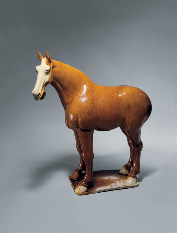 AN AMBER-GLAZED POTTERY FIGURE OF A HORSE