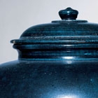 A LARGE BLUE-GLAZED POTTERY JAR AND COVER