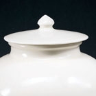 AN EARLY WHITE PORCELAIN JAR AND COVER