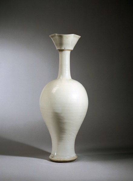 A TALL WHITE-GLAZED STONEWARE VASE