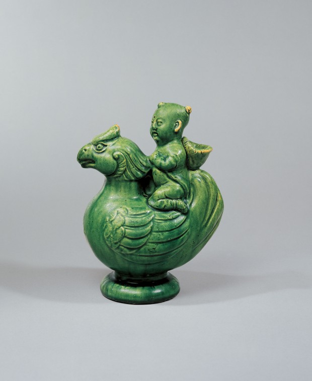 A GREEN-GLAZED POTTERY ‘BOY AND PHOENIX’ EWER