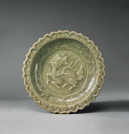 A MOULDED LONGQUAN CELADON DISH WITH QILIN