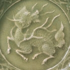 A MOULDED LONGQUAN CELADON DISH WITH QILIN