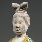 A LARGE SANCAI GLAZED POTTERY ATTENDANT