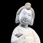 A WHITE MARBLE FIGURE OF A COURTESAN