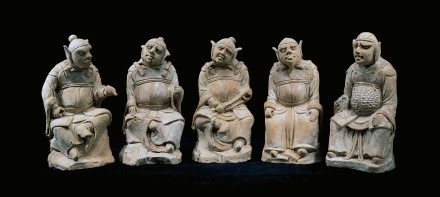 A GROUP OF FIVE RED POTTERY WARRIOR DEITIES