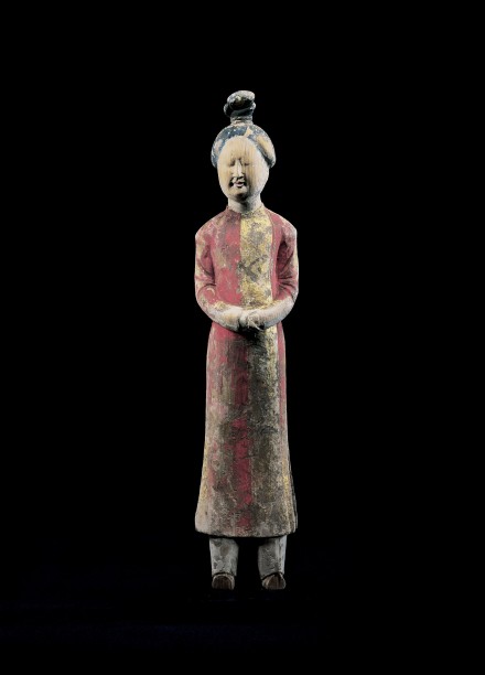 A PAINTED AND GILDED WOOD FIGURE OF A COURT ATTENDANT