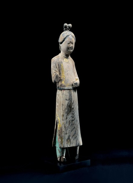 A PAINTED AND GILDED WOOD FIGURE OF A COURT ATTENDANT