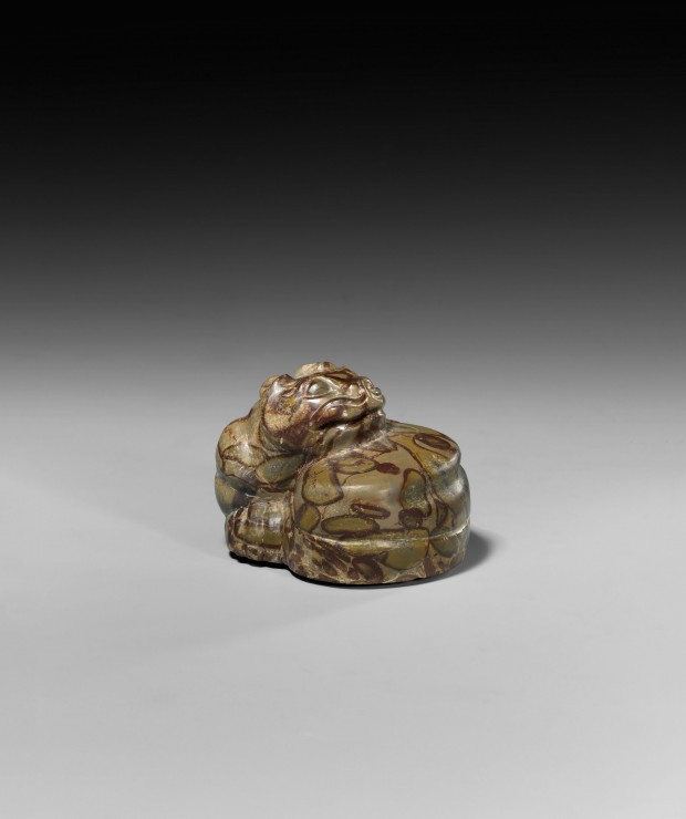 A PUDDINGSTONE TIGER-FORM MAT WEIGHT