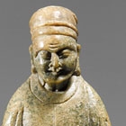 AN EARLY SOAPSTONE CARVING OF A SAGE