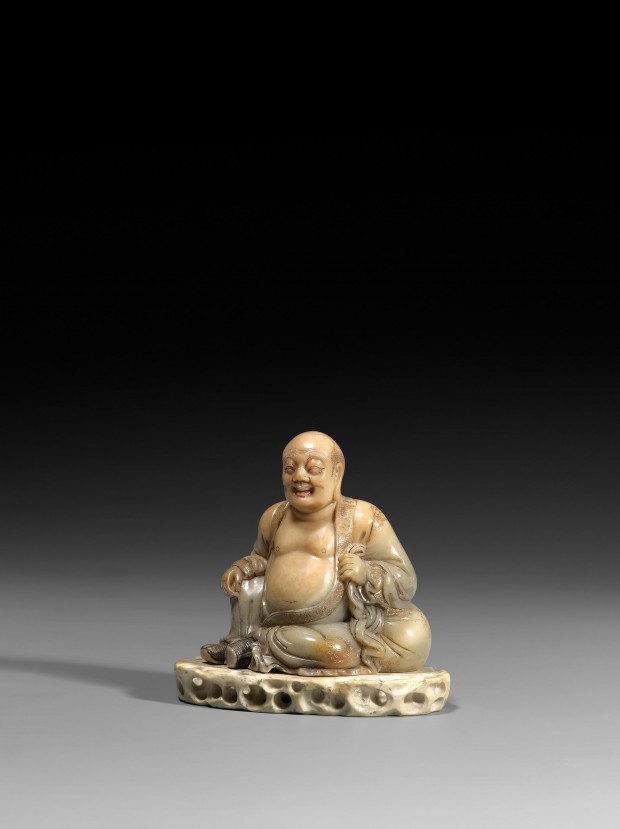 A SOAPSTONE FIGURE OF BUDAI