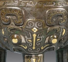 A GOLD- AND SILVER-INLAID ARCHAISTIC BRONZE TRIPOD CENSER