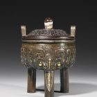 A GOLD- AND SILVER-INLAID ARCHAISTIC BRONZE TRIPOD CENSER