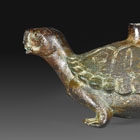 A BRONZE TORTOISE-FORM WATER DROPPER