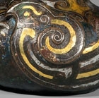 A GOLD- AND SILVER-INLAID BRONZE WATERPOT