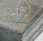 A ‘FISH IN WAVES’ TWIN INKSTONE AND COVER