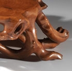 A CARVED BOXWOOD ROOT-FORM LOW TABLE