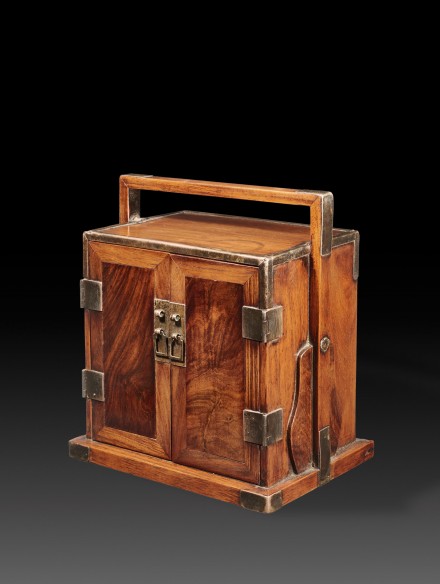 A HUANGHUALI SMALL TRAVELLING CHEST