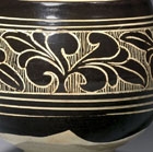 A CARVED ‘BLACK- AND WHITE’-GLAZED CIZHOU STONEWARE BOWL