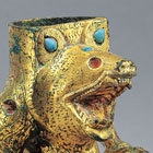 AN INLAID GILT BRONZE BEAR