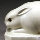 A WHITE PORCELAIN FIGURE OF A RABBIT