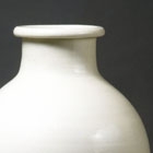 A TALL WHITE PORCELAIN VASE