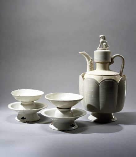 A WHITE PORCELAIN EWER AND COVER WITH WARMING BASIN, CUPS AND CUPSTANDS