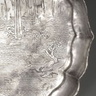 AN ENGRAVED SILVER ‘RED CLIFF’ PICTORIAL DISH