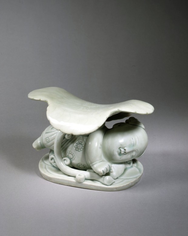 A YINGQING PORCELAIN ‘BOY AND LILYPAD’ PILLOW