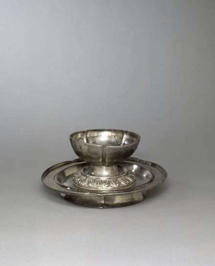 A SILVER FLOWER-SHAPED WINECUP AND STAND