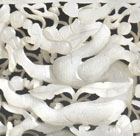 AN OPENWORK WHITE JADE DRAGON PLAQUE