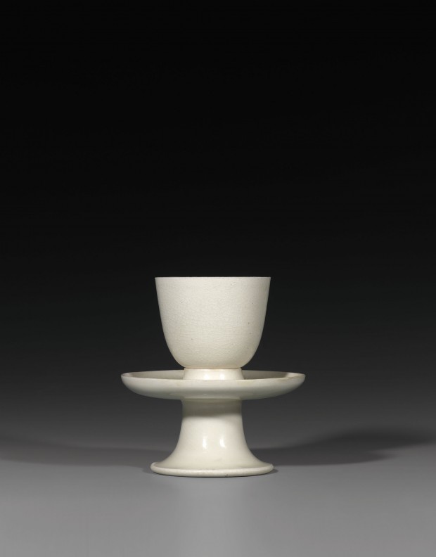 A CUP AND PEDESTAL STAND