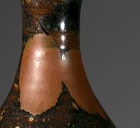 A RUSSET-SPLASHED BROWN-GLAZED BOTTLE-VASE (YUHUCHUN PING)