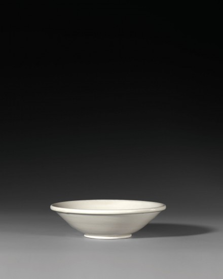A SHALLOW BOWL ON ‘BI-DISC’ FOOT