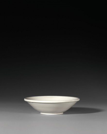 A SHALLOW BOWL ON ‘BI-DISC’ FOOT