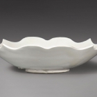 A QUATREFOIL DISH WITH BARBED RIM