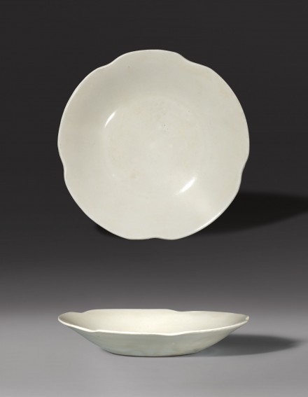 AN INSCRIBED FLOWER-SHAPED DISH