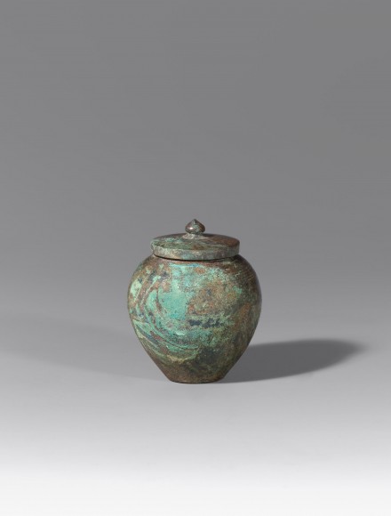A SMALL BRONZE COVERED JAR