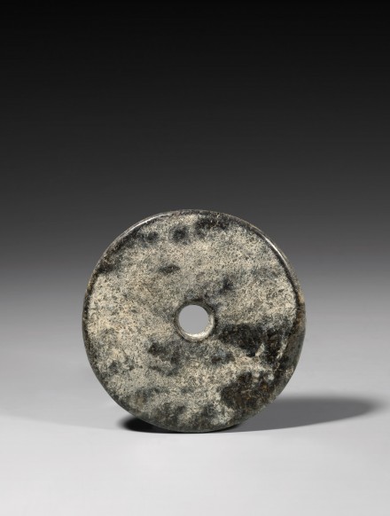 A NEOLITHIC DARK GREEN JADE BI DISC