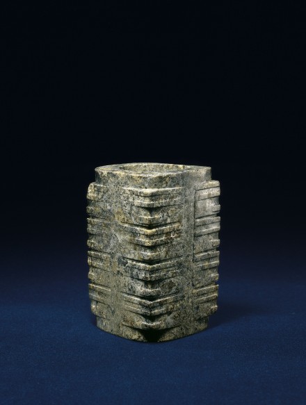A NEOLITHIC MOTTLED GREEN AND TAN JADE CONG