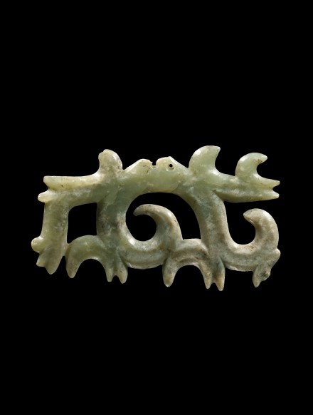 A NEOLITHIC JADE OPENWORK HOOKED CLOUD FORM PENDANT