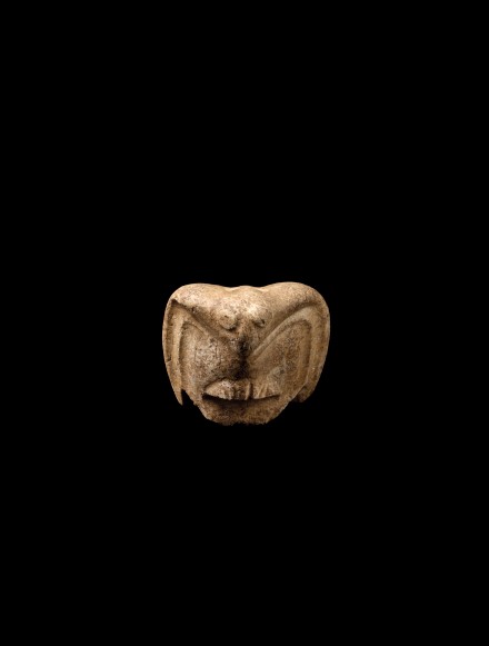 A NEOLITHIC WHITE MARBLE OWL FORM PENDANT