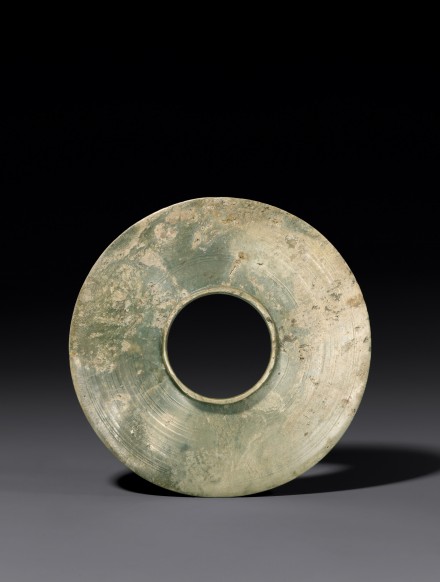 A JADE BI DISC WITH COLLARED CENTRAL APERTURE