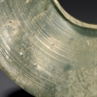 A JADE BI DISC WITH COLLARED CENTRAL APERTURE