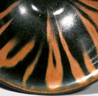 A YAOZHOU RUST-DECORATED BLACK-GLAZED BOWL