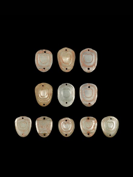 ELEVEN PETAL SHAPED JADE ORNAMENTS