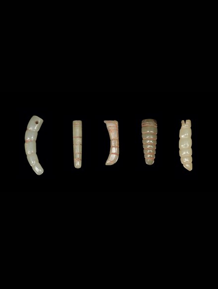 FIVE JADE SILKWORM FORM PENDANTS