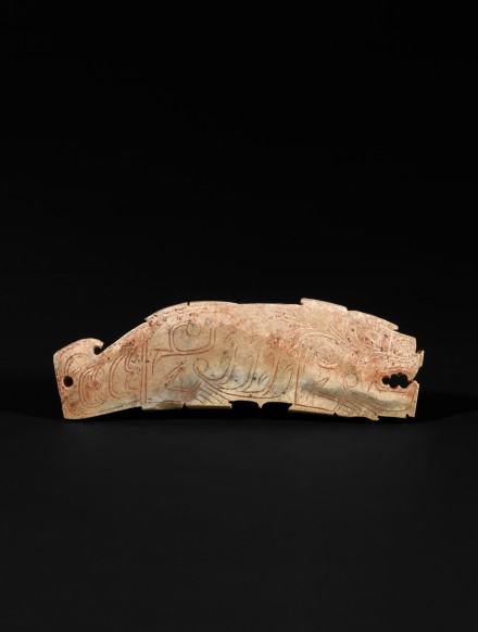 AN INCISED JADE TIGER FORM PLAQUE