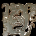 AN OPENWORK JADE ENTWINED DRAGONS ORNAMENT